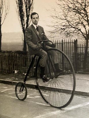 Dad riding his Penny farthing.  