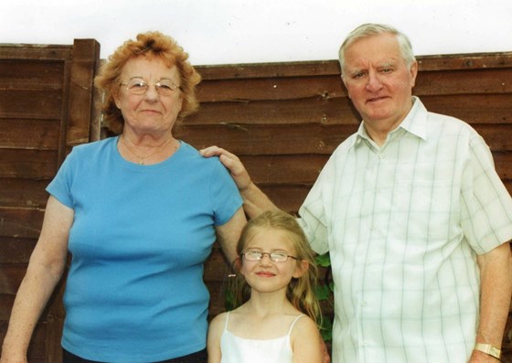 Mum and dad with Racheal after her Holy Communion in 2006 