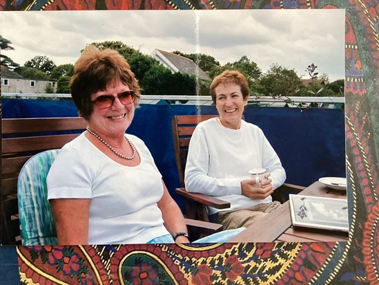 Proud mum sharing wedding photos.2006 on balcony with Bernice N.