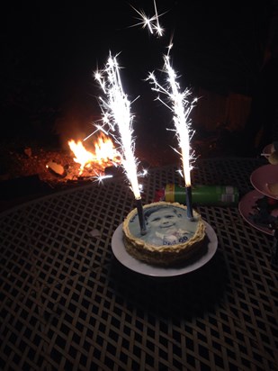 Dad's 60th birthday cake complete with fire in the background!