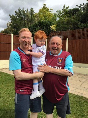 Papa, Dada and George in their West Ham shirts.