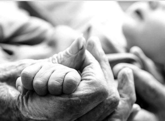 One of my favourites, grandma holding Harry's hand