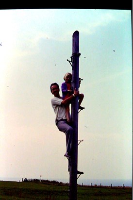 Robin and Row, climbing a pole at Whitby