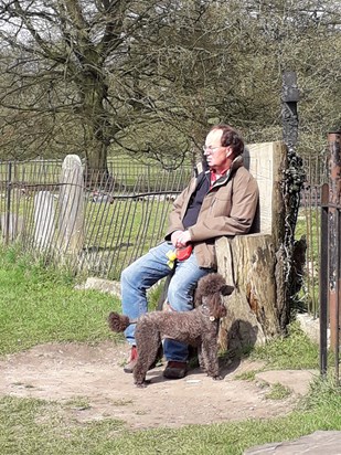 Andrew on his thrown, with Polly dog