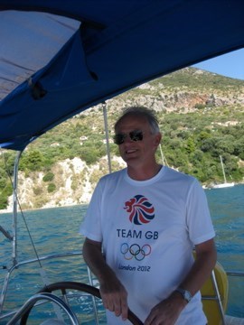 Always happy at the helm - this time off Greece a month after memorable days at the Olympic rowing and dressage at London 2012