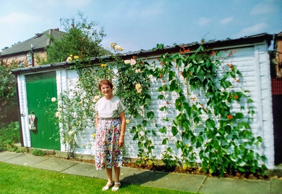Mum in her garden, she loved roses