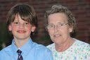 Jimmy at his sixth grade graduation with Grandma Diane