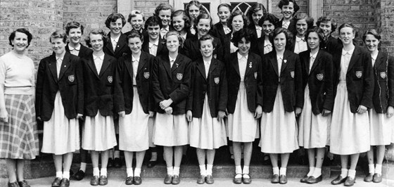 School photo of Jill (front row left next to teacher)