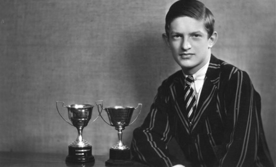Joe, Head Boy at Carre's Grammar School, with his sporting trophies