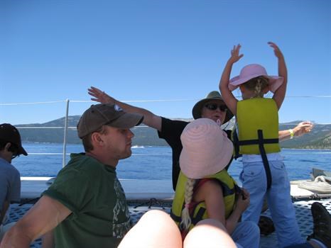 Opa flying high with the grandkids on a boat in Tahoe