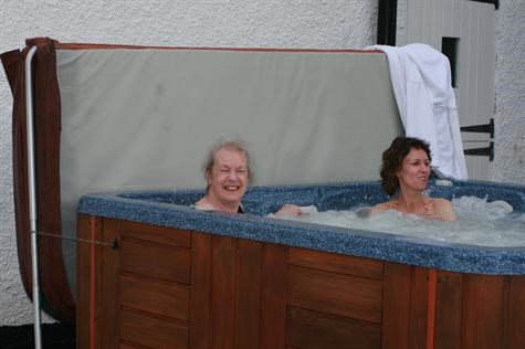 Mum enjoying a hot tub with Pauline - June 2007