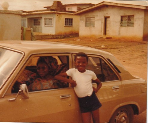 David posing next to mums car