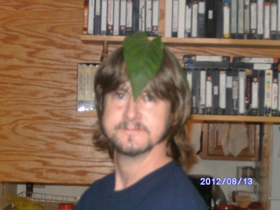 Brian with leaf on head