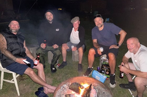 John and our four sons round the campfire.