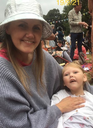 Sophie and Mummy enjoying music in the park