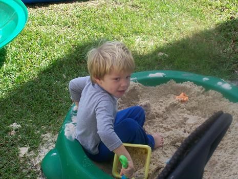 Cayden in his sandbox