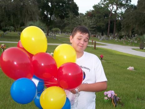 jason holding the balloons