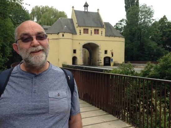 Paul by an old toll gate in Bruges