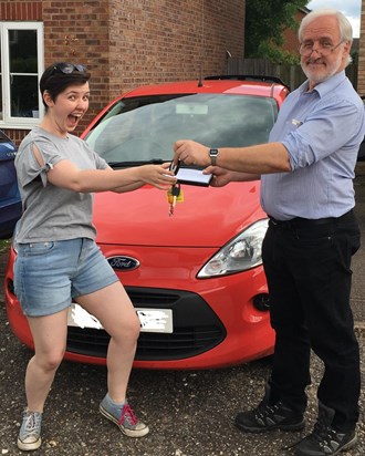A very excited Sarah getting the keys to her car.  