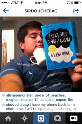 His caption that was cut off "reading a geek book and various cups under my chin.
