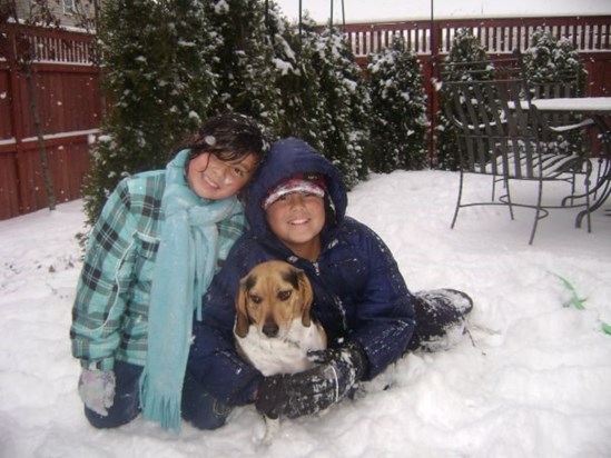 Playing in the snow with his sister Sophia and with his dog Rocky, 2009