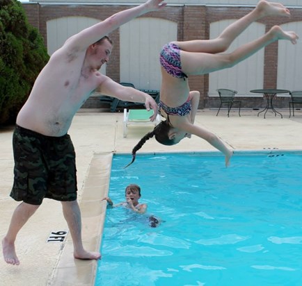 Mike playing with the kids in the pool