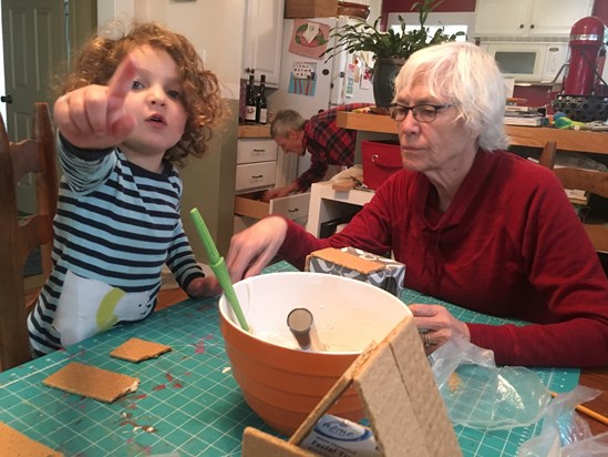 Z instructs on proper gingerbread house construction. Gran eyes with some trepidation. 