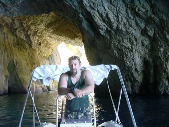 In one of the many caves we really weren't meant to take the boat into. Paxos, 2005.