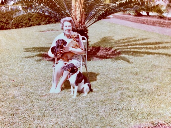 Mum with her 4 legged friends in the Limbe garden.