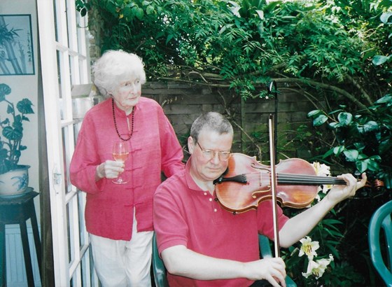 ben and kiki with viola in garden  
