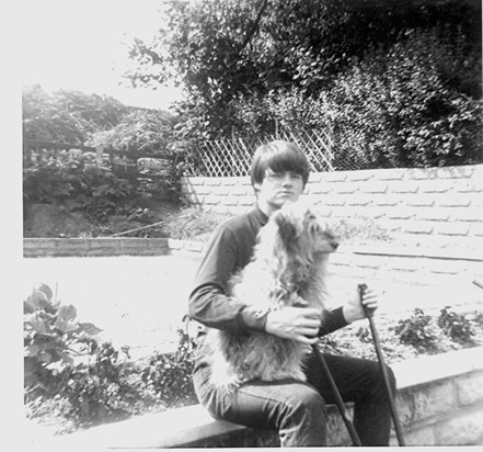 Derek with Pepe in garden c. 1964