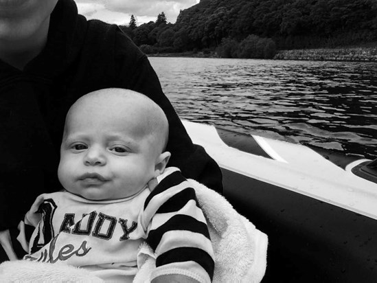 on a inflatable boat with me, daddy and lala (you have your mammys pout)