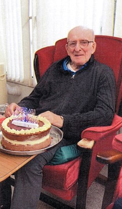 Peter enjoying his cake on his 89th birthday