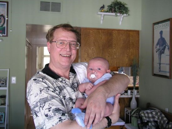 Here is Jesse with Uncle Steve Bowman ~ 9/9/07  There's the 'passy' and balled up little fists!