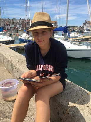 Crabbing and reading at Weymouth Harbour