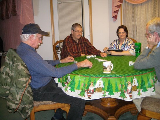 Dad enjoys a domino game.