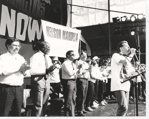 Bob Hughes - centre, beyond Allan Boesak - at Glasgow Green rally 12th June, 1988. Jim Kerr singing "Mandela Day".