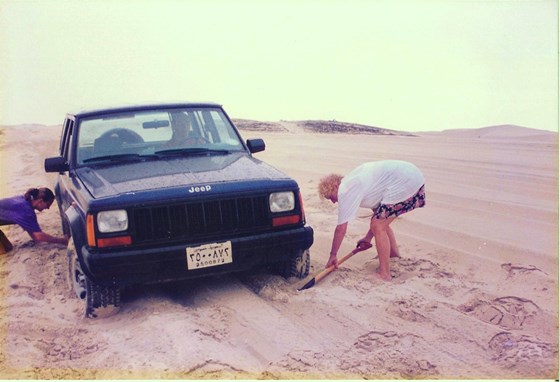 Gran helping to dig the car out of the sand in Saudi Arabia