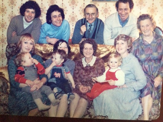 Bob with his family in the late 70s. As you can see, his smile never changed! :)