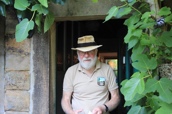 Showing me his books in the front garden