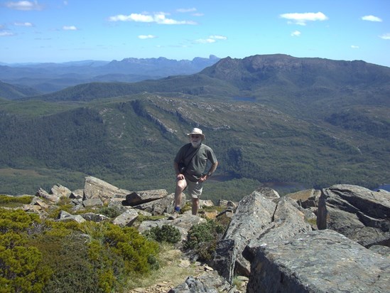 GM on Mt Rufus, with Frenchmans Cap on the skyline, Lake St Clair, Tas