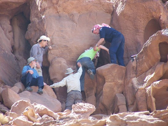 Gordon joined us on Tony's Jordan trip. Here is Gordon in green at the "naughty step"  in Wadi Rum, gracefully helped by John, George and Tony