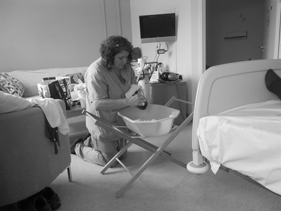 Our wonderful midwife Mickey giving Bonita her first hair wash