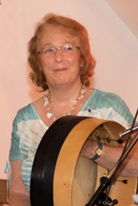 Pauline playing her Bodhrán