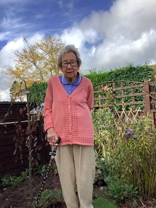 Next to the weeping crab apple tree she planted last year 