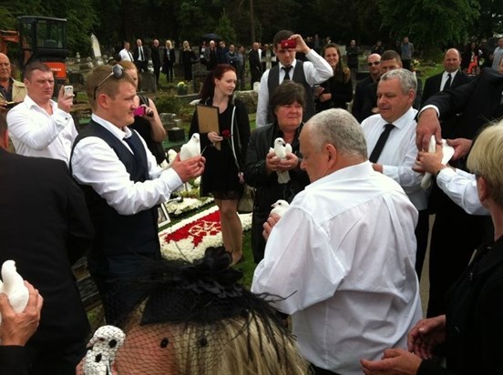 THE RELEASE OF 12 DOVE TO SYMBOLISE HIS LIFE LIVED 