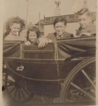 Dad and sisters Connie and Alma with unknown boy circa 1945