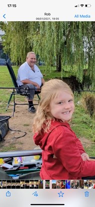 Andy fishing with his granddaughter Imogen