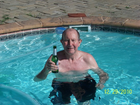 Granddad enjoying his favourite drink at the pool at Vaal Oewer.