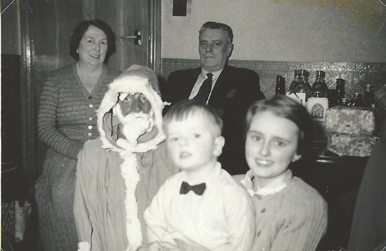 A traditional Christmas. Brenda with brother Roland, Grandad & Grandma Talbot and Mum Jane as Santa.